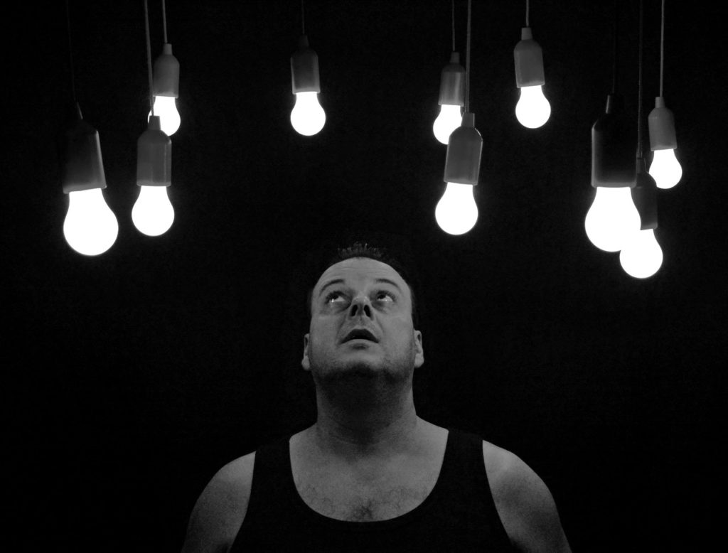 Man looking at bulbs
